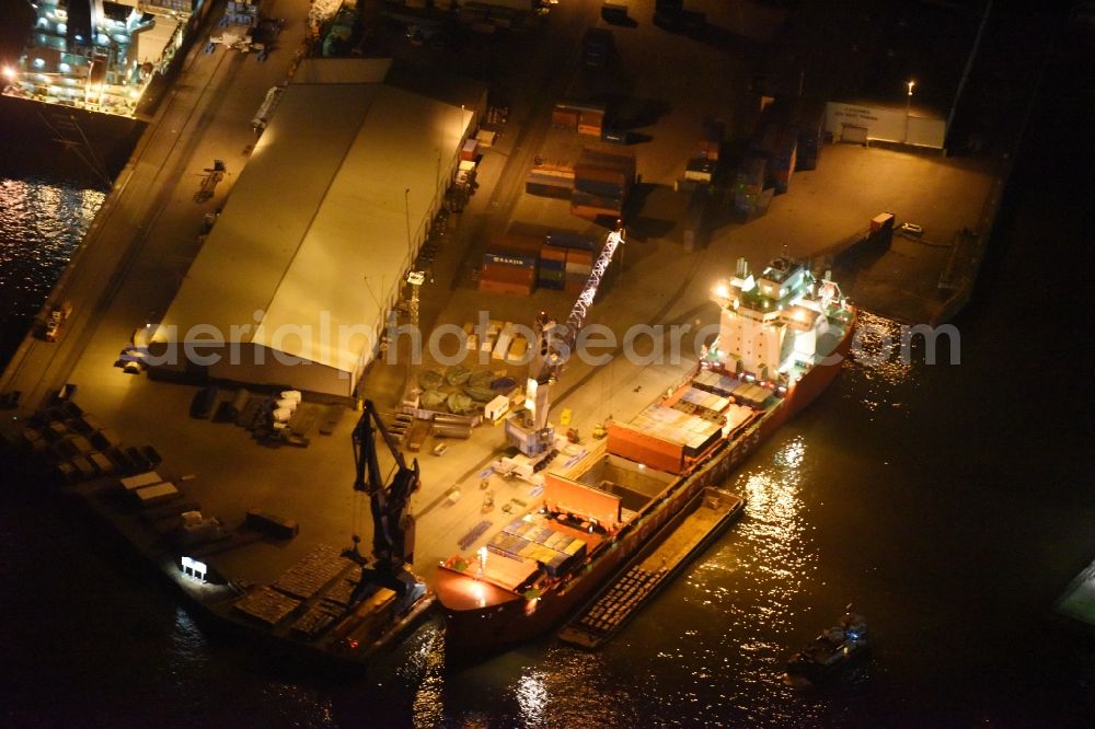 Aerial image at night Hamburg - Night view Container ship Trollerort - Steinwerder shore of Norderelbe port aerea in Hamburg