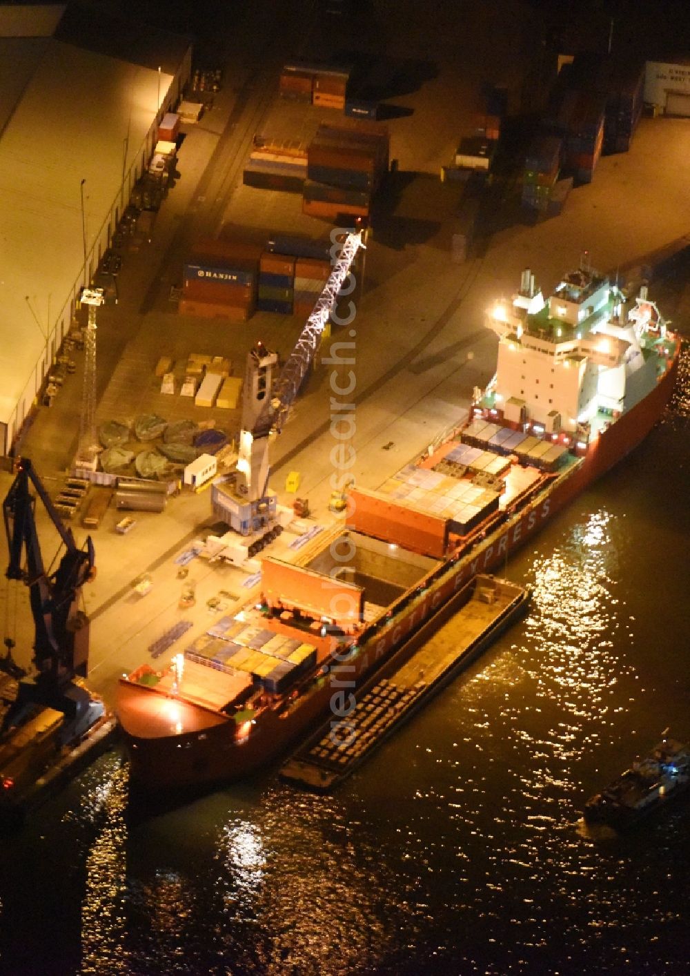 Hamburg at night from above - Night view Container ship Trollerort - Steinwerder shore of Norderelbe port aerea in Hamburg