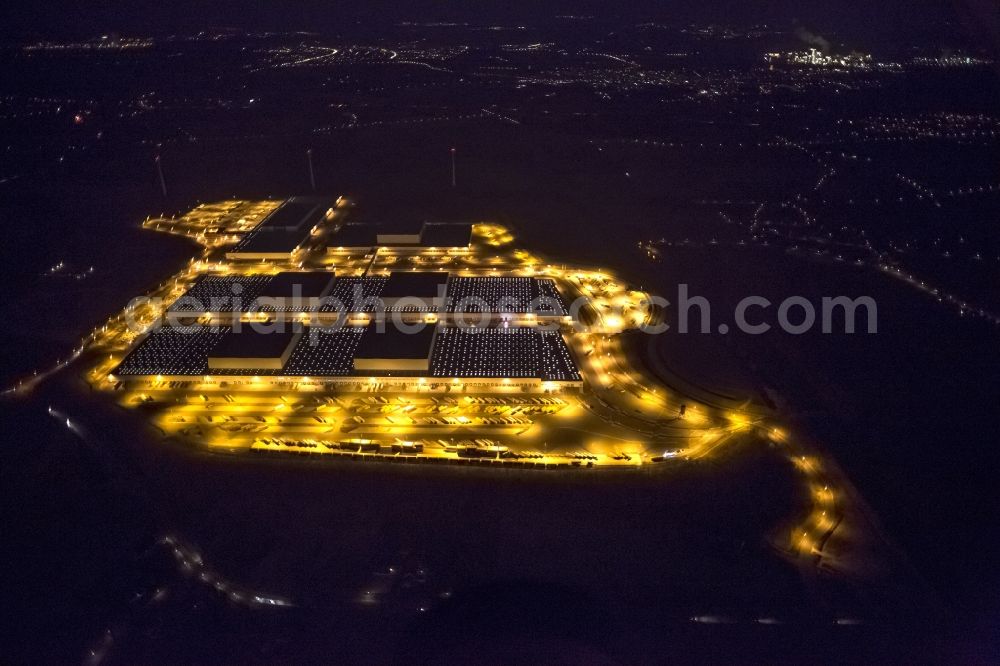 Dortmund at night from the bird perspective: Night view at the distribution centre of IKEA, which was built on a former heap