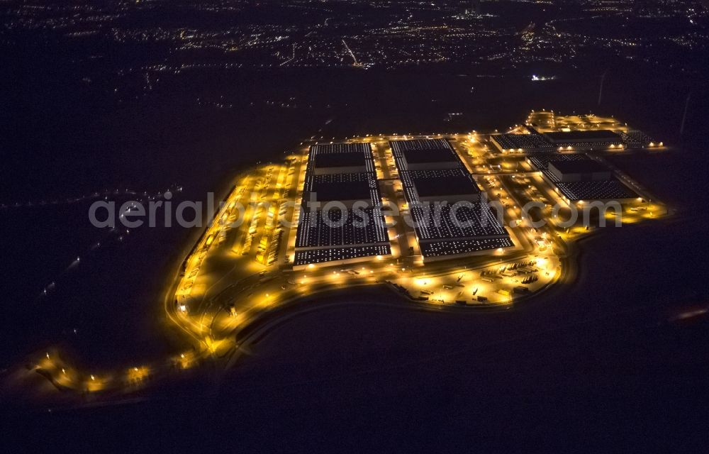 Dortmund at night from the bird perspective: Night view at the distribution centre of IKEA, which was built on a former heap