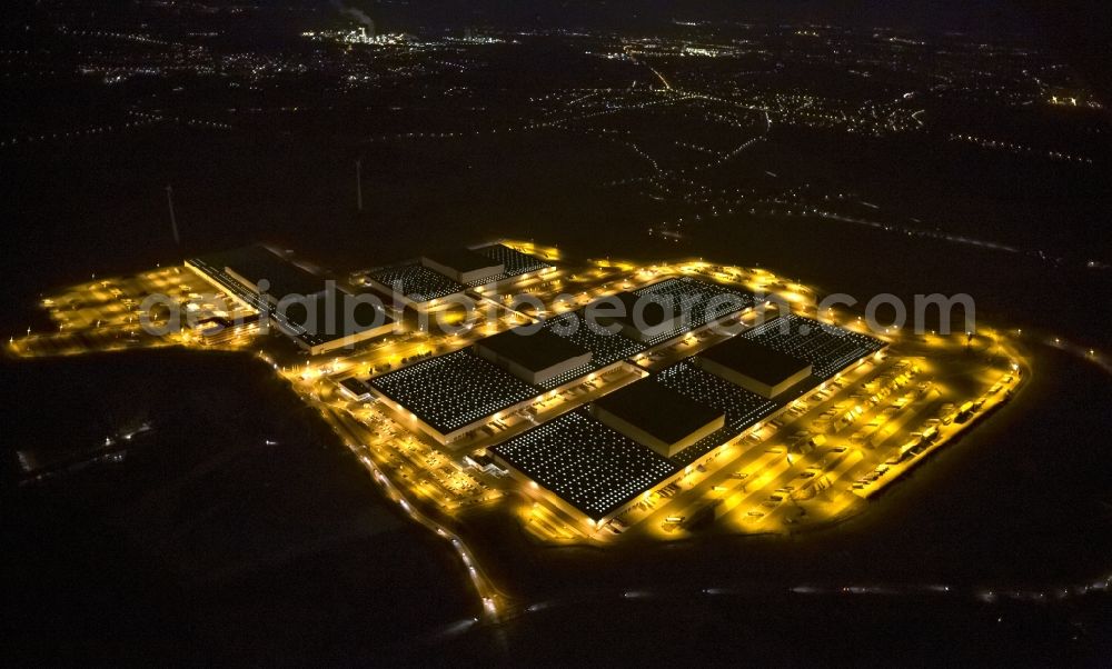 Dortmund at night from the bird perspective: Night view at the distribution centre of IKEA, which was built on a former heap