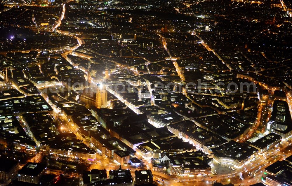 Aerial image at night München - City view of the Old Town at the Frauenkirche at the New Town Hall and place Karlsplatz in the center of Munich in Bavaria