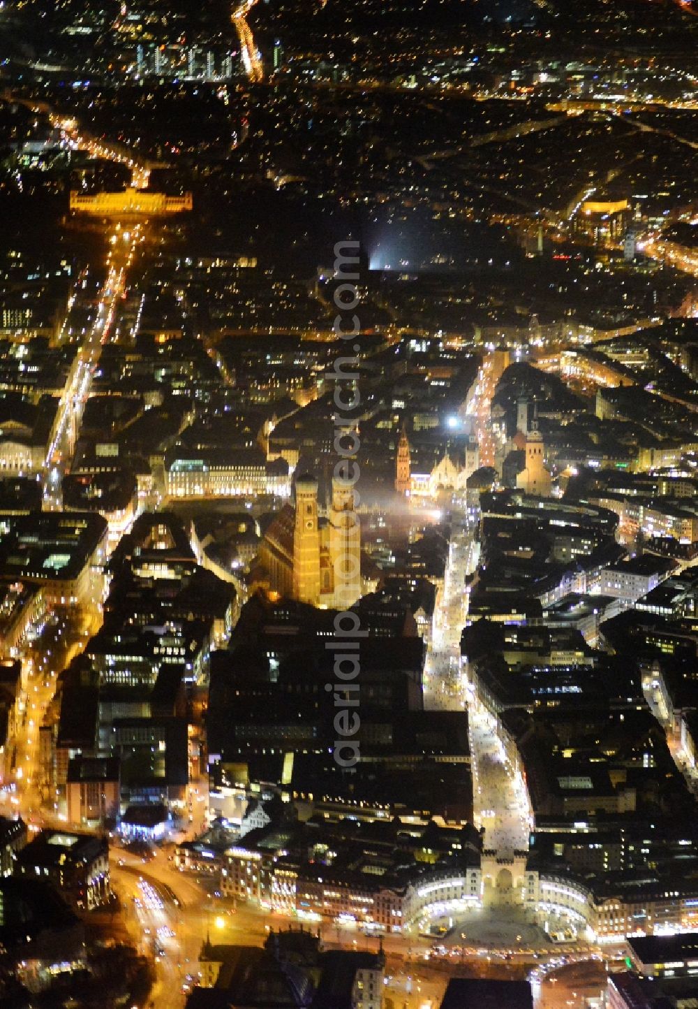 München at night from above - City view of the Old Town at the Frauenkirche at the New Town Hall and place Karlsplatz in the center of Munich in Bavaria