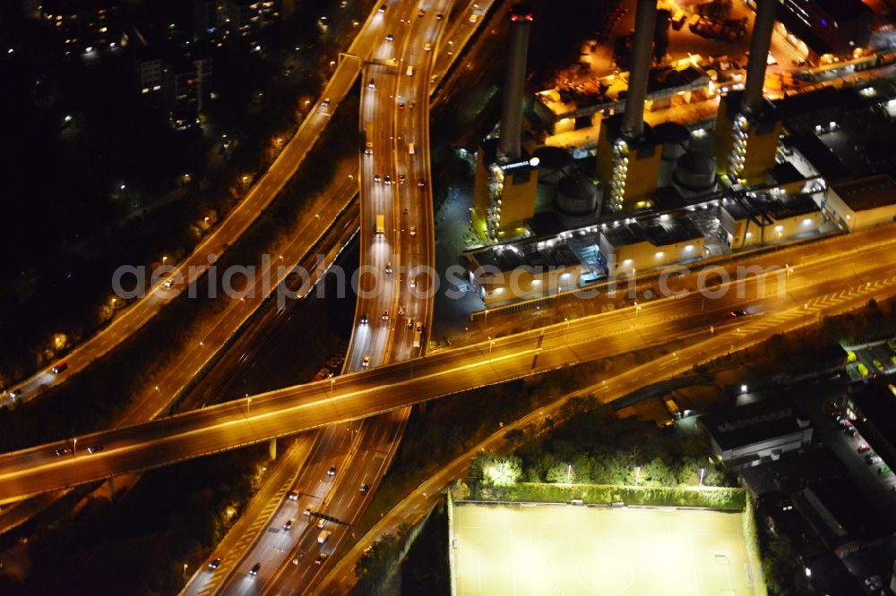 Berlin-Wilmersdor at night from above - Yellow / Orange Night shot of a power plant in the district of Charlottenburg-Wilmersdorf. Operator is Vattenfall Europe AG. The heating plant is located on the Forckenbeckstrasse in Berlin