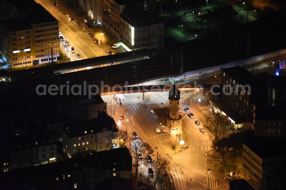 Aerial image at night Frankfurt am Main - Night view Station building and track systems of the S-Bahn station Galluswarte on Mainzer Landstrasse in Frankfurt in the state Hesse