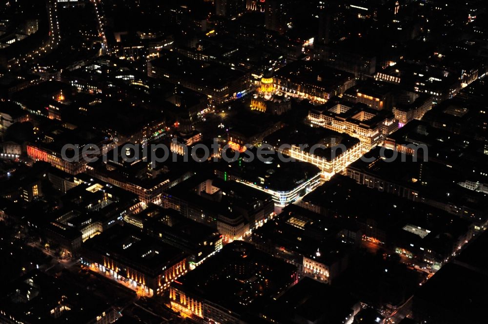 Berlin at night from the bird perspective: Night view of downtown east around the Gendarmenmarkt in the district Mitte in Berlin. The Gendarmenmarkt, occasional called the most beautiful square in Berlin, is a place in the historical center of Berlin