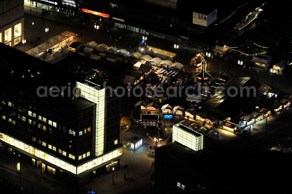 Aerial photograph at night Berlin - Nightview of the Oktoberfest at Alexanderplatz in the district Mitte in Berlin. Located betweenn ALEXA und Saturn it consists of several booths with Bavarian specialties and a marquee. Promoter is the federal state of Bavaria