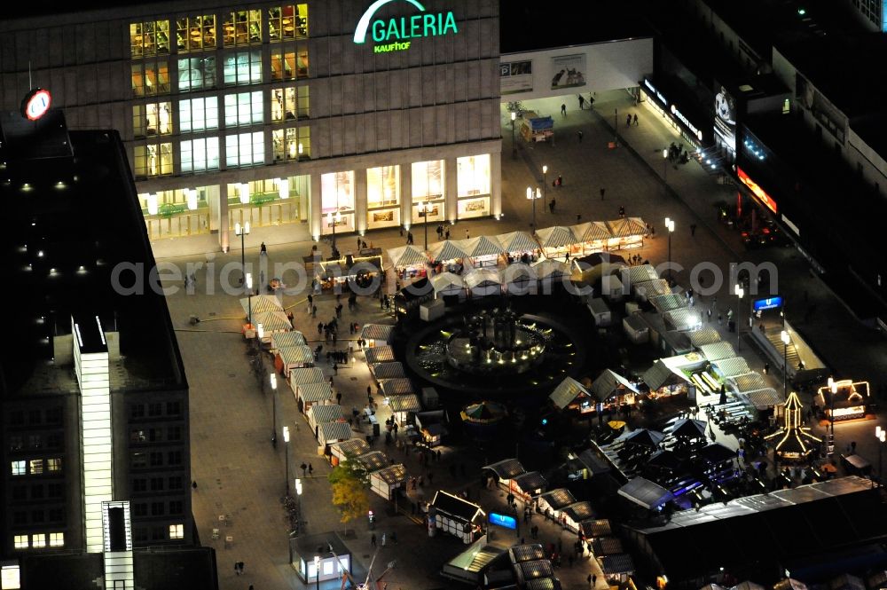 Berlin at night from above - Nightview of the Oktoberfest at Alexanderplatz in the district Mitte in Berlin. Located betweenn ALEXA und Saturn it consists of several booths with Bavarian specialties and a marquee. Promoter is the federal state of Bavaria