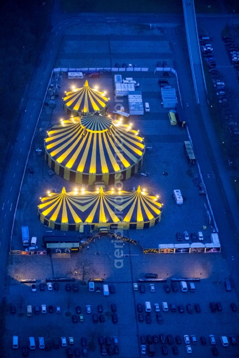 Dortmund at night from the bird perspective: Night shot of the circus tent circus Flic Flac with the 3rd Christmas Circus Beautiful Day Fire! in Dortmund in North Rhine-Westphalia