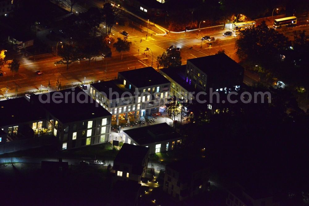 Berlin Dahlem at night from the bird perspective: Night aerial photo of the new construction Fuenf Morgen Dahlem Urban Village in Berlin