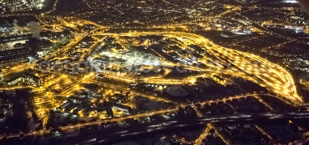 Duisburg Hamborn at night from the bird perspective: Night view from the industrial area of the freight yard in Duisburg-Hamborn and factory premises of ThyssenKrupp Steel AG in Duisburg plant Bruckhausen in North Rhine-Westphalia