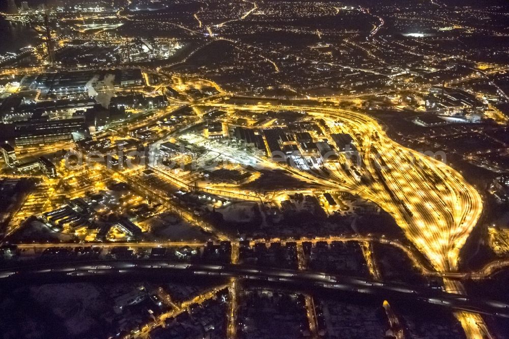 Aerial photograph at night Duisburg Hamborn - Night view from the industrial area of the freight yard in Duisburg-Hamborn and factory premises of ThyssenKrupp Steel AG in Duisburg plant Bruckhausen in North Rhine-Westphalia