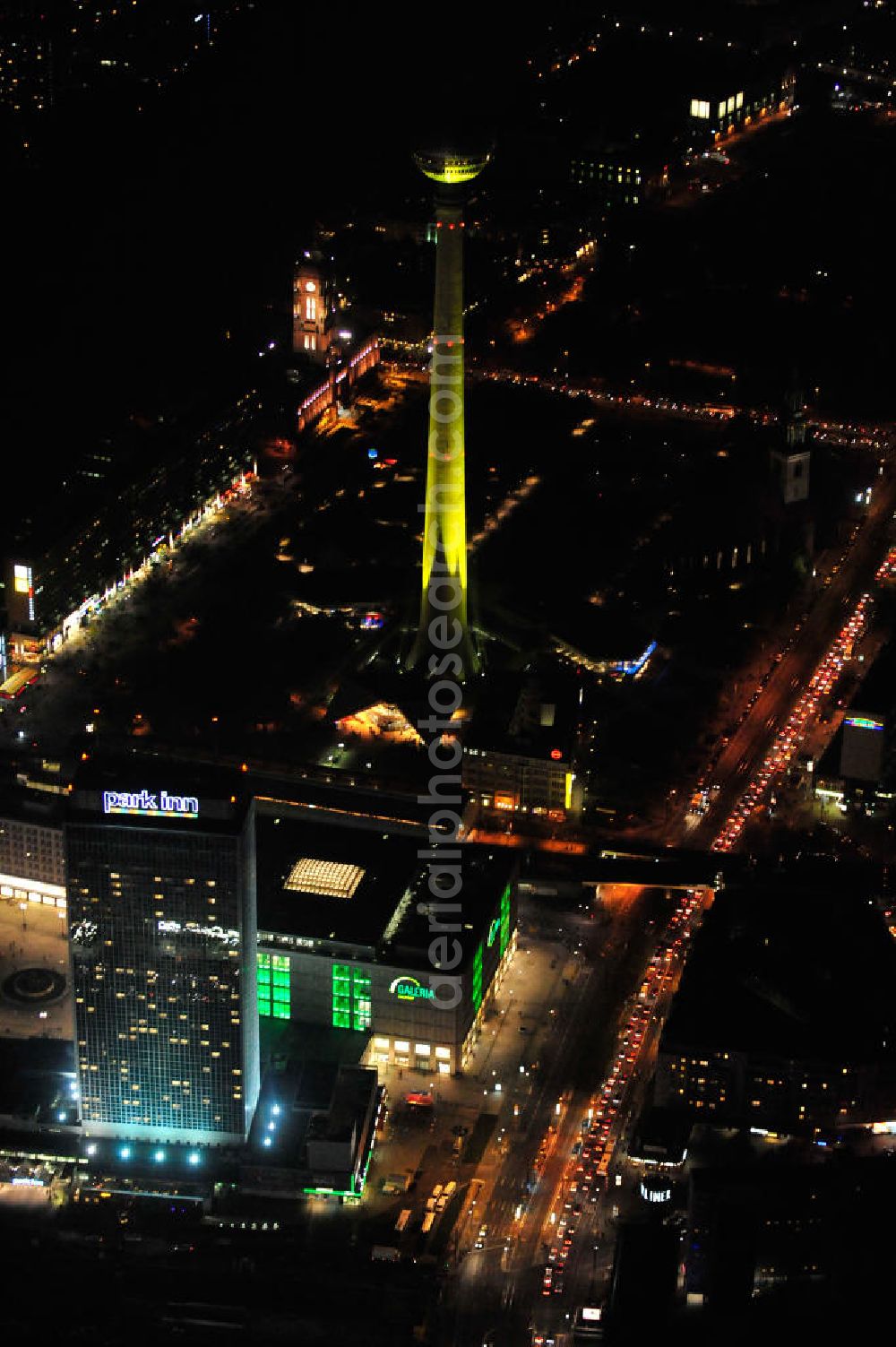 Aerial image at night Berlin - Nachtaufnahme: Park Inn Hotel, Kaufhaus Galeria Kaufhof, Bahnhof und Berliner Fernsehturm am Alexanderplatz mit Beleuchtung anläßlich des Festival of Lights. Night Shot: View of the Hotel, Shipping Mall and the Berlin TV Tower at the Alexanderplatz with illumination at the Festival of Lights.