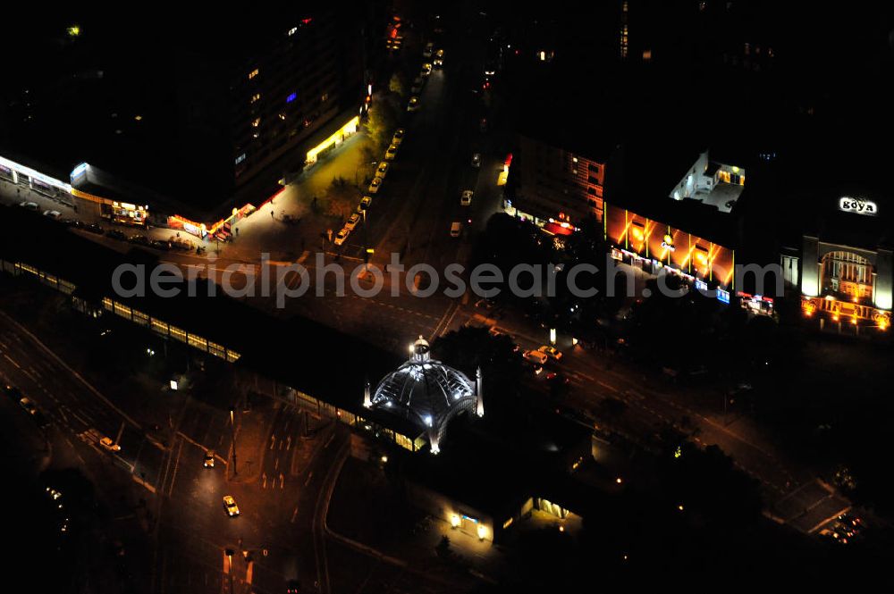 Aerial image at night Berlin - Nachtaufnahme: Nollendorfplatz in Berlin-Schöneberg mit dem Hochbahnhof der U-Bahn-Linie 2. Hier treffen sich die Einemstraße, die Maaßenstraße, die Kleiststraße und die Bülowstraße. Zu sehen auch das Gebäude der Ü-30-Party der media.one GmbH. Night shot: The square Nollendorfplatz with the station of the overhead railway.