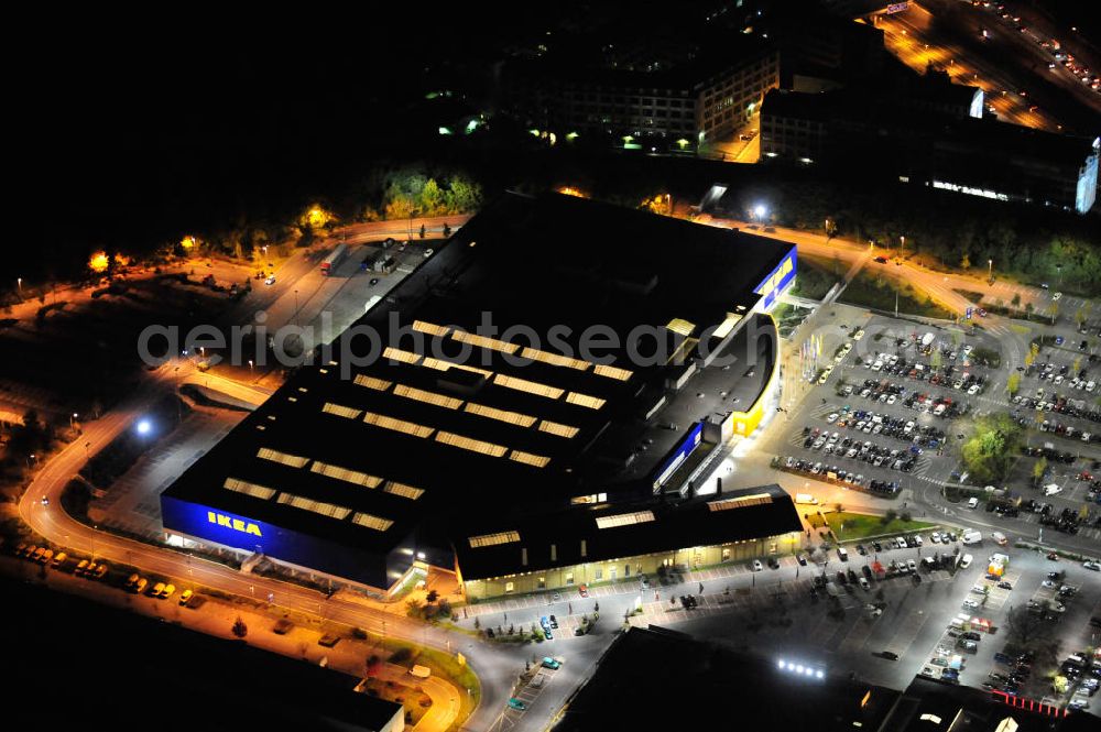 Berlin at night from the bird perspective: Nachtaufnahme: Blick auf das IKEA Einrichtungshaus im Gewerbegebiet in Berlin-Tempelhof. Night shot: View of the furniture store IKEA in Berlin-Tempelhof.