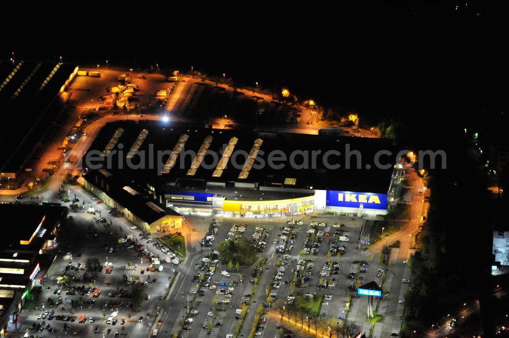 Berlin at night from the bird perspective: Nachtaufnahme: Blick auf das IKEA Einrichtungshaus im Gewerbegebiet in Berlin-Tempelhof. Night shot: View of the furniture store IKEA in Berlin-Tempelhof.