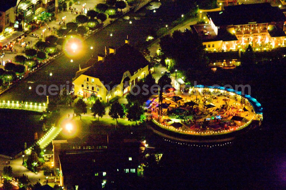 Aerial photograph at night Oberhausen - Nachtaufnahme von Teilen des CentrO Freizeitpark und des CentrO Einkaufszentrum in Oberhausen, Nordrhein-Westfalen, dieser wurde im Rahmen des Kunstprojektes Extraschicht beleuchtet. Night shot of parts of the CentrO amusement park and the CentrO shopping mall in Oberhausen, North Rhine-Westphalia. It was iluminated in context of the art project Extraschicht.