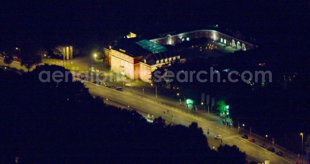 Aerial image at night Oberhausen - Nachtaufnahme des Oberhausener Schlosses in Nordrhein-Westfalen. Der einste Rittersitz Oberhaus gab der Stadt ihren heutigen Namen. Das klassizistische Schloss beherbergt unter an derem ein Kunstmuseum sowie Veranstaltungsräume und einen Trausaal. Das Schloss wurde im Rahmen des Kunstprojektes Extraschicht beleuchtet. Night shot of the Castle Oberhausen in North Rhine-Westphalia. The city is named after the former knight settle Oberhaus. Nowadays it accomodates an art museum, functional rooms as well as a wedding hall. It was iluminated in context of the arts project Extraschicht.