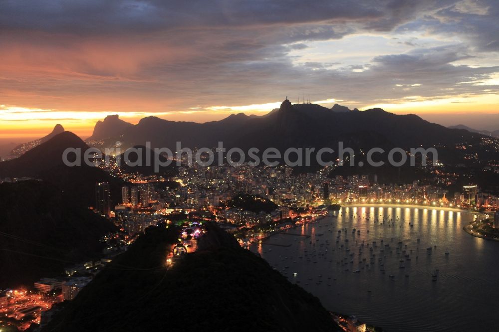 Rio de Janeiro at night from the bird perspective: Beach and coastal area on the outskirts of Ipanema in Rio de Janeiro in Brazil