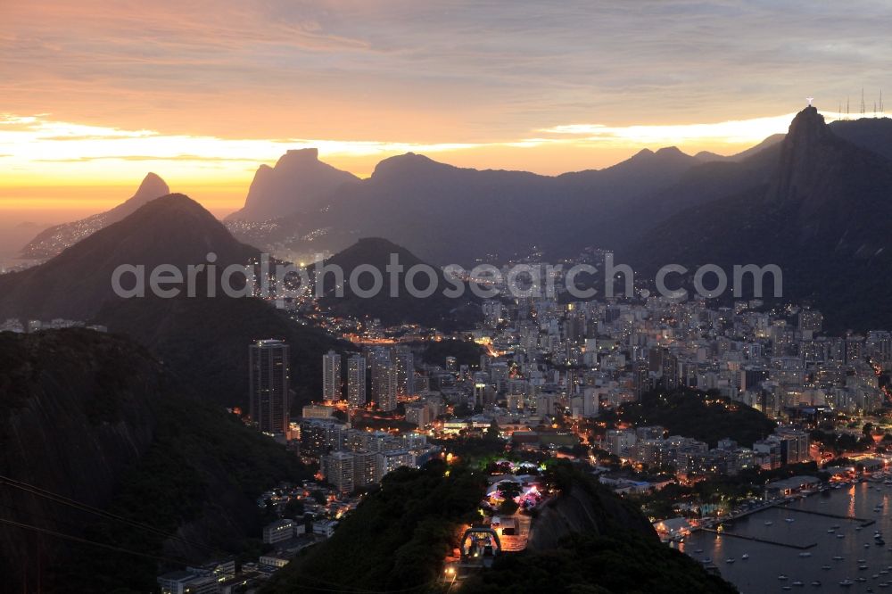 Rio de Janeiro at night from the bird perspective: Beach and coastal area on the outskirts of Ipanema in Rio de Janeiro in Brazil