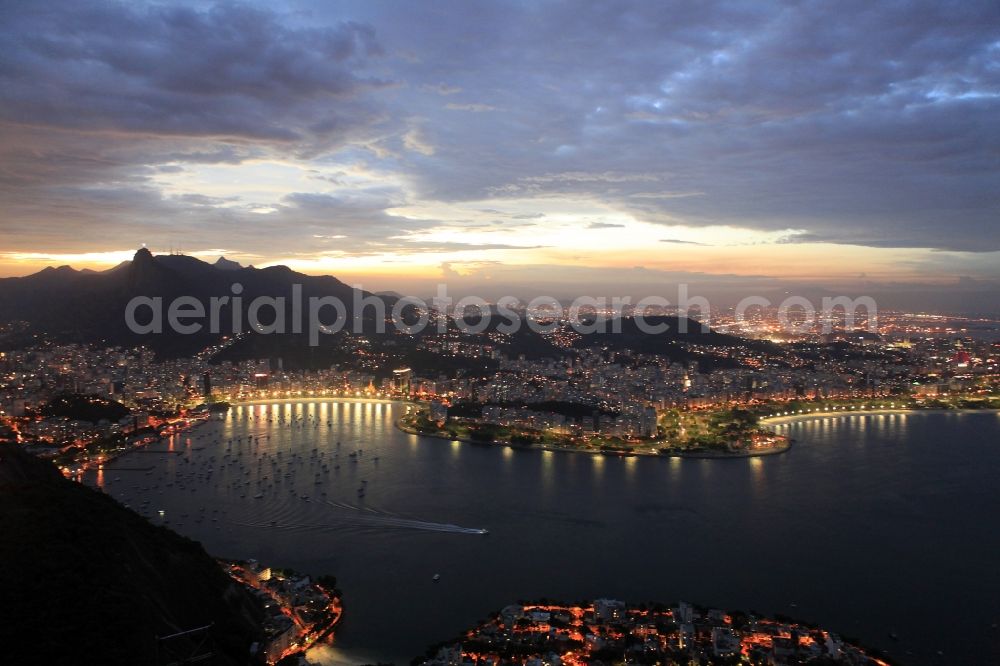 Rio de Janeiro at night from the bird perspective: Beach and coastal area on the outskirts of Ipanema in Rio de Janeiro in Brazil