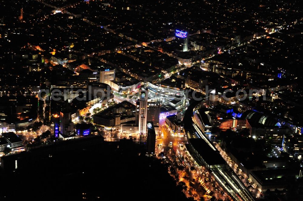 Aerial image at night Berlin - Night view at the Hardenbergplatz and the Zoo station in the district Charlottenburg in Berlin. The Hardenbergplatz is a sub center in the City West