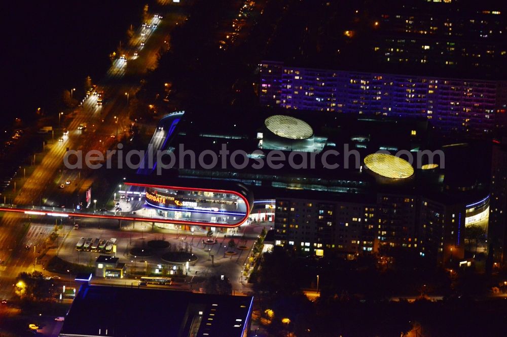 Berlin at night from the bird perspective: Night Aerial View of Shopping Center East Gate with coherent nocturnal lighting. The development, general planning, leasing and long-term management of the Eastgate project management are in the hands of the ECE. The shopping center is located in the Marzahn district on the main road axis Maerkische Allee in Berlin