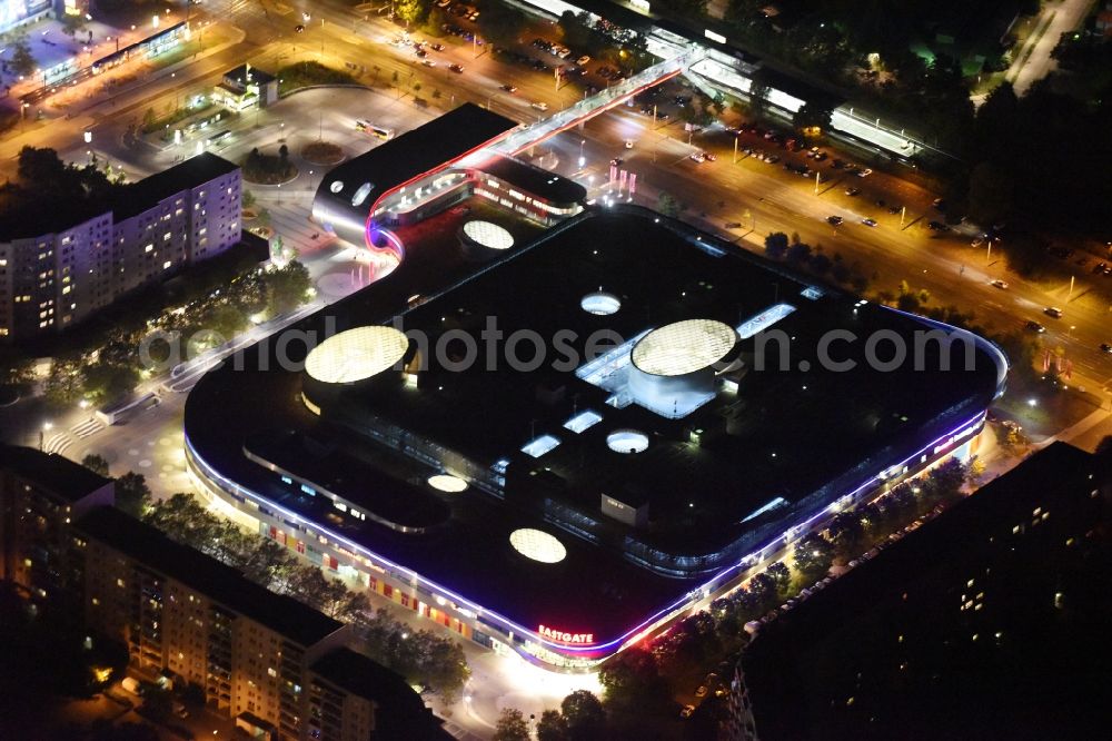 Aerial image at night Berlin - Night Aerial View of Shopping Center East Gate with coherent nocturnal lighting. The development, general planning, leasing and long-term management of the Eastgate project management are in the hands of the ECE. The shopping center is located in the Marzahn district on the main road axis Maerkische Allee in Berlin