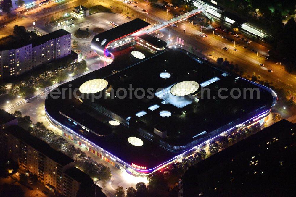 Berlin at night from above - Night Aerial View of Shopping Center East Gate with coherent nocturnal lighting. The development, general planning, leasing and long-term management of the Eastgate project management are in the hands of the ECE. The shopping center is located in the Marzahn district on the main road axis Maerkische Allee in Berlin