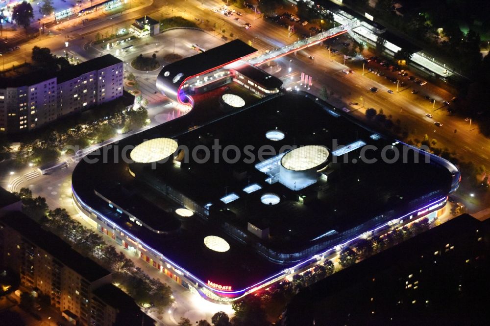 Berlin at night from the bird perspective: Night Aerial View of Shopping Center East Gate with coherent nocturnal lighting. The development, general planning, leasing and long-term management of the Eastgate project management are in the hands of the ECE. The shopping center is located in the Marzahn district on the main road axis Maerkische Allee in Berlin