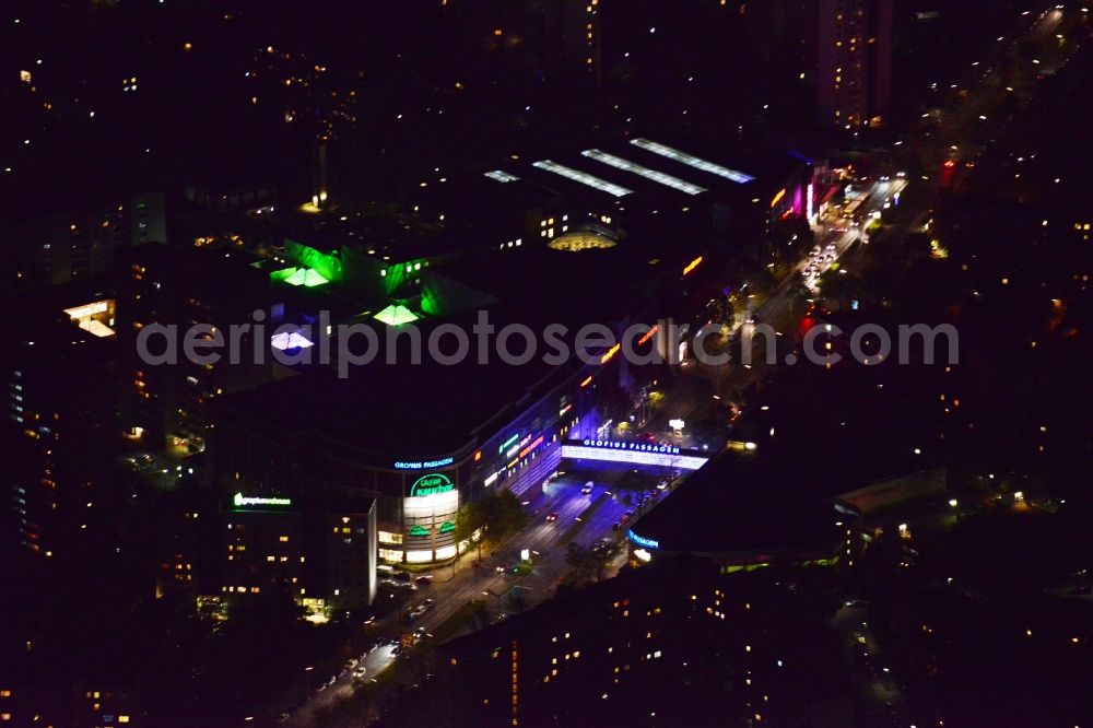 Berlin Neukölln at night from above - Night aerial view from the shopping center Gropiuspassagen coherent with night lighting. The development, general planning, leasing and long-term management of Gropiuspassagen lie in the hands of the mfi management fuer immobilien AG. The shopping center is located in the Neukoelln district at the Johannisthaler Chaussee in Berlin