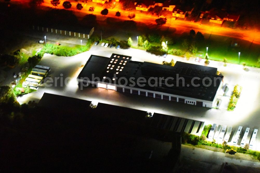 Aerial image at night Güstrow - Night lighting Depot of the Municipal Transport Company rebus regional bus Rostock GmbH on Parumer Weg in Guestrow in the state Mecklenburg - Western Pomerania, Germany