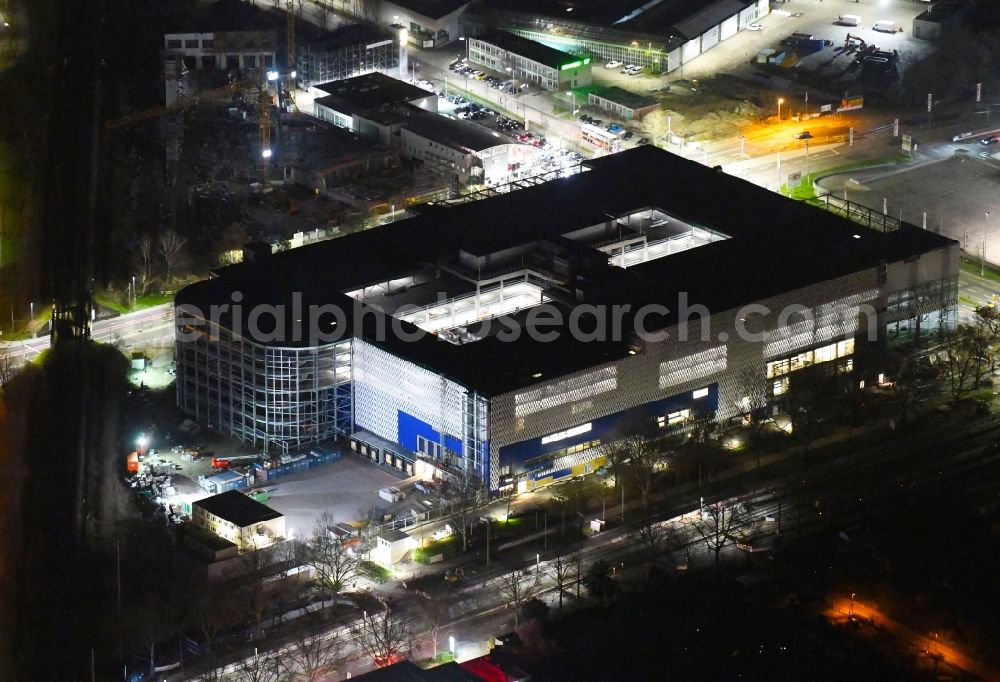 Aerial image at night Karlsruhe - Night lighting construction site for the new building of the furniture store - furniture market on Weinweg - Gerwingstrasse - Ostring in the district Oststadt in Karlsruhe in the state Baden-Wurttemberg, Germany