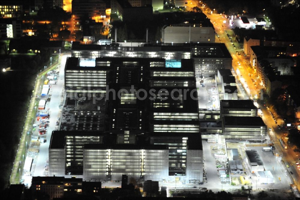 Aerial photograph at night Berlin - Night lighting Construction of BND headquarters on Chausseestrasse in the Mitte district of the capital Berlin. The Federal Intelligence Service (BND) built according to plans by the Berlin architectural firm Kleihues offices in the capital its new headquarters