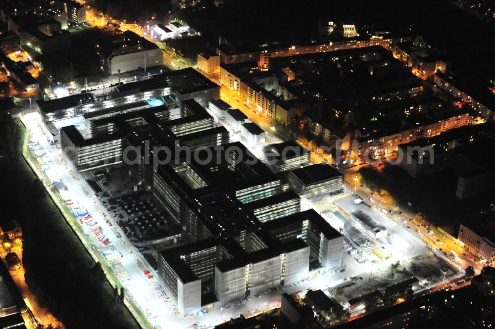 Berlin at night from above - Night lighting Construction of BND headquarters on Chausseestrasse in the Mitte district of the capital Berlin. The Federal Intelligence Service (BND) built according to plans by the Berlin architectural firm Kleihues offices in the capital its new headquarters