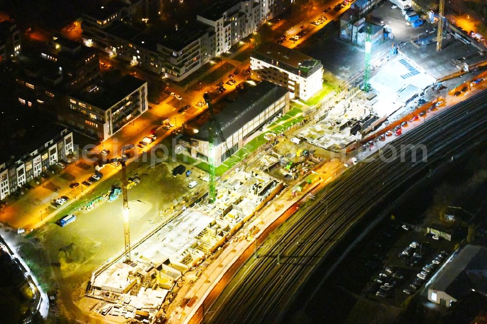 Berlin at night from above - Night lighting Construction site to build a new office and commercial building B:HUB on Kynaststrasse - Alt-Stralau in Berlin, Germany