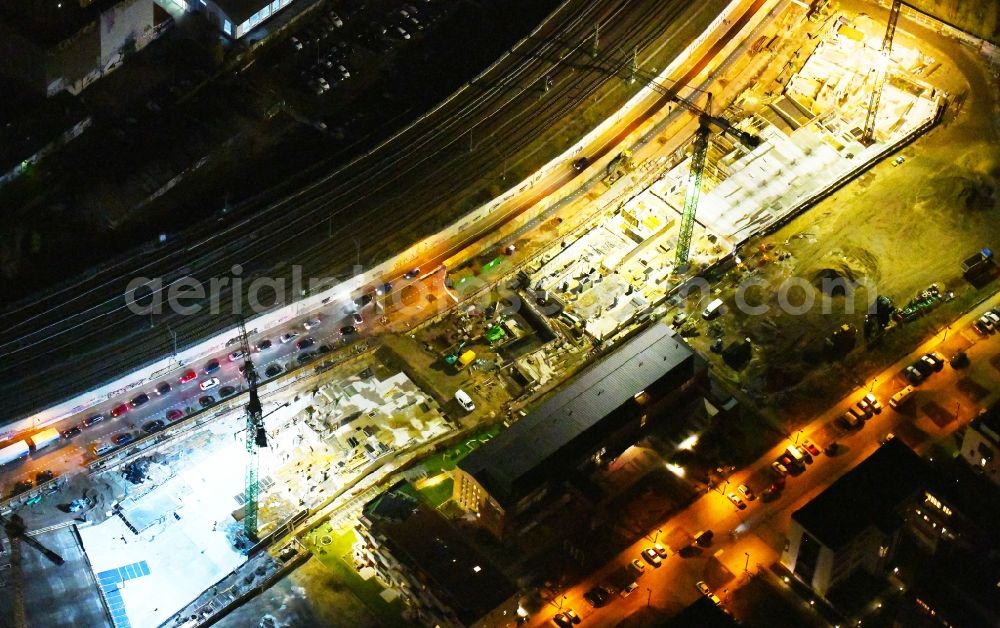 Berlin at night from above - Night lighting Construction site to build a new office and commercial building B:HUB on Kynaststrasse - Alt-Stralau in Berlin, Germany