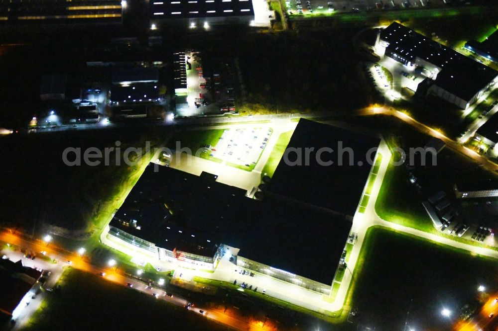 Hoppegarten at night from the bird perspective: Night lighting View of the Europazentrale Clinton in Hoppegarten in the state of Brandenburg