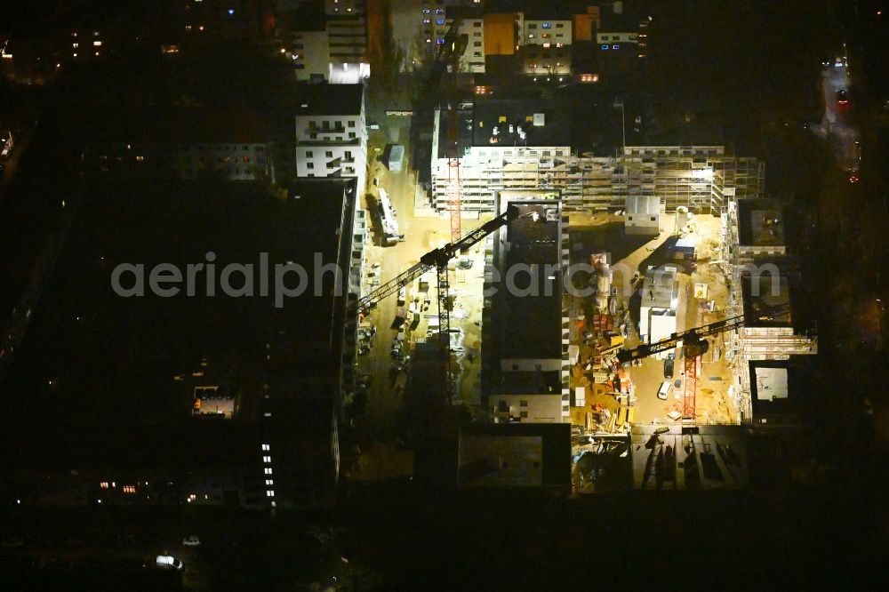 Aerial image at night Berlin - Night lighting construction site to build a new multi-family residential complex Dessauerstrasse - Retzowstrasse in the district Lankwitz in Berlin, Germany