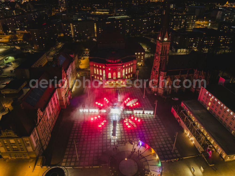 Aerial image at night Chemnitz - Night lights and illumination of the Chemnitz Opera House with Theaterplatz on the occasion of the festival Illuminarium - the sound and light festival of film nights and the Petrikirche in Chemnitz in the federal state of Saxony