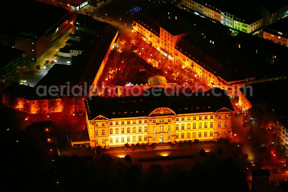 Zweibrücken at night from the bird perspective: Night lighting palace on place Schlossplatz in the state Rhineland-Palatinate, Germany