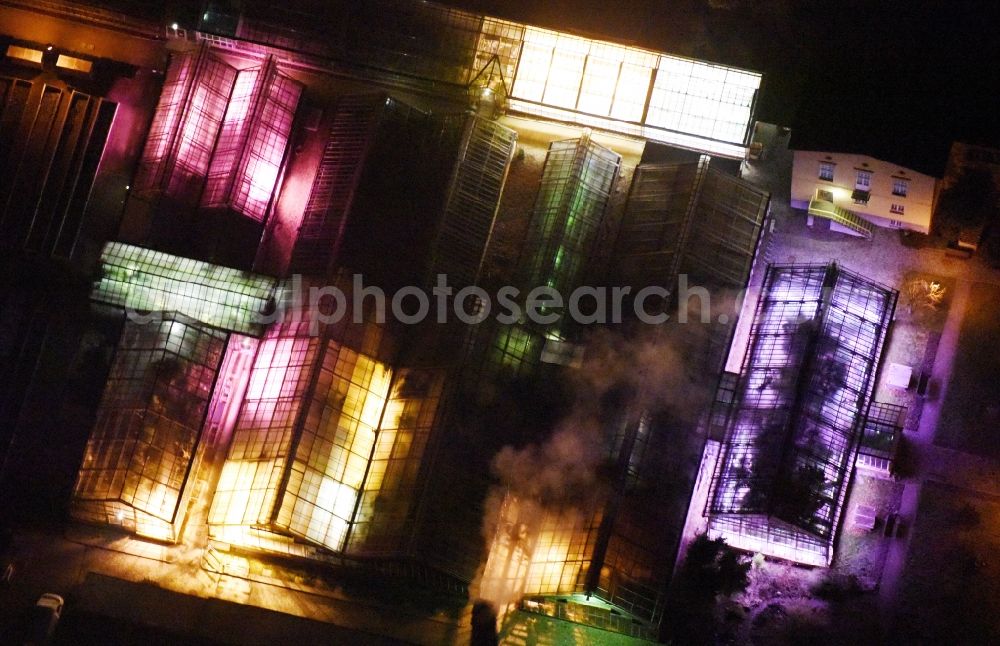 Potsdam at night from above - Night illumination of the greenhouse facilities at the Paradiesgarten - Botanical Garden in Potsdam in the state of Brandenburg