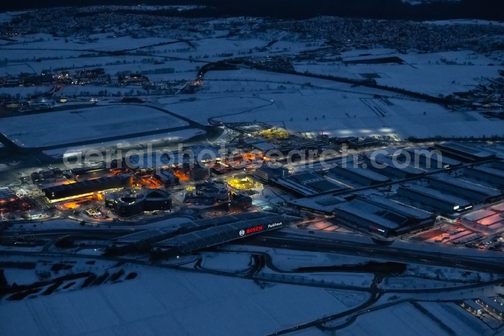 Aerial image at night Stuttgart - Night lighting parking deck on the building of the Bosch car park in the district Plieningen in Stuttgart in the state Baden-Wuerttemberg