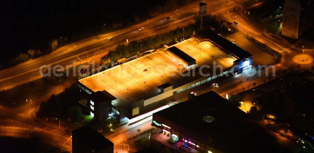 Aerial photograph at night Neubrandenburg - Night lighting Parking deck on the building of the car park Lindetal Center on Juri-Gagarin-Ring in Neubrandenburg in the state Mecklenburg - Western Pomerania, Germany