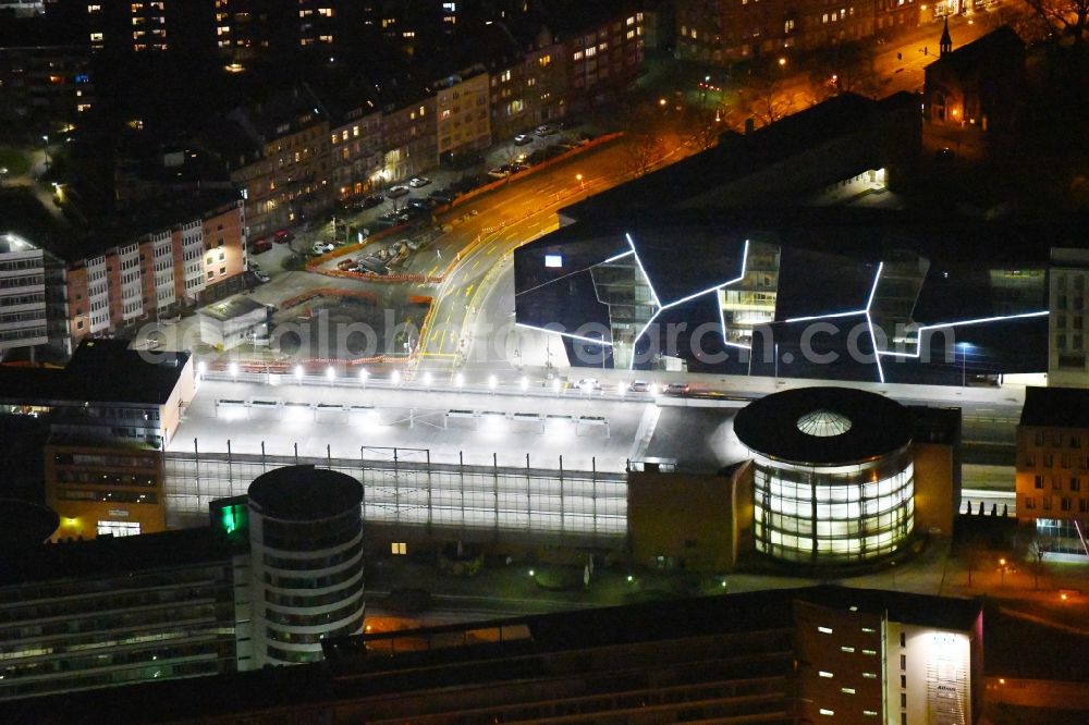 Karlsruhe at night from the bird perspective: Night lighting parking deck on the building of the car park Parkhaus in Scheck-In Center on Rueppurrer Strasse in Karlsruhe in the state Baden-Wurttemberg, Germany