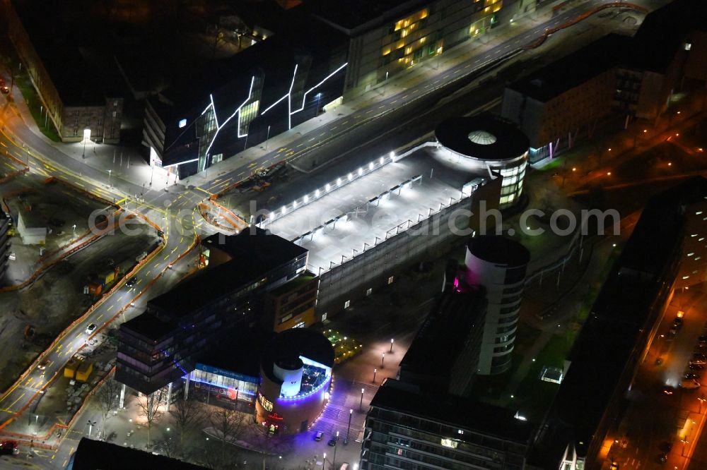 Aerial photograph at night Karlsruhe - Night lighting parking deck on the building of the car park Parkhaus in Scheck-In Center on Rueppurrer Strasse in Karlsruhe in the state Baden-Wurttemberg, Germany