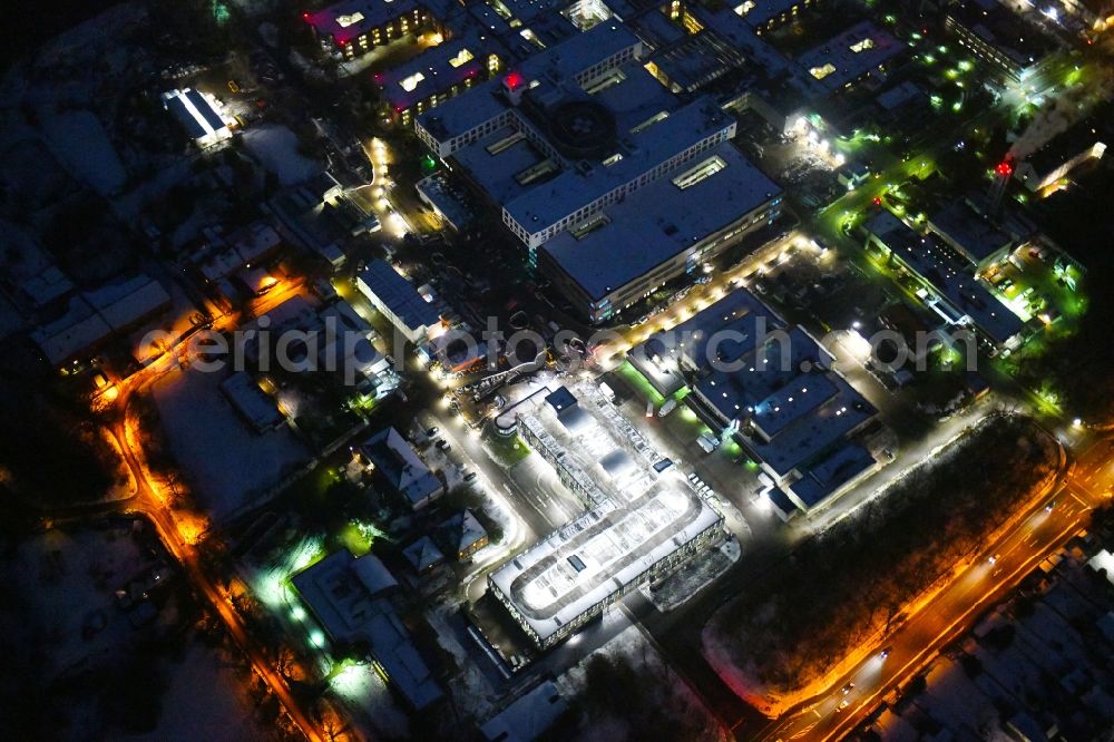 Lübeck at night from the bird perspective: Night lighting parking deck on the building of the car park in UKSH Universitaetsklinikum Schleswig-Holstein in the district Strecknitz in Luebeck in the state Schleswig-Holstein, Germany