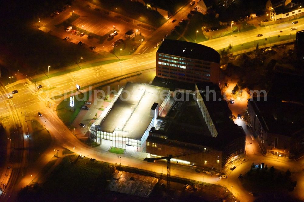 Rostock at night from above - Night lighting Parking deck on the building of the car park Am Strande - Gaffelschonerweg - Loggerweg in Rostock in the state Mecklenburg - Western Pomerania, Germany