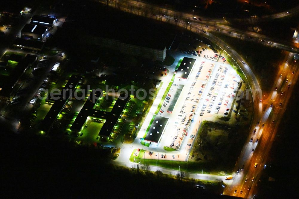 Berlin at night from above - Night lighting Parking and storage space for automobiles of Autohauses Autoland Niederlassung Berlin Alt-Friedrichsfelde in Berlin, Germany