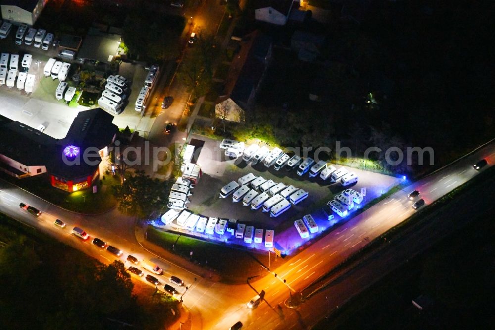 Aerial image at night Hoppegarten - Night lighting parking and storage space for automobiles Caravan Center Matner in the district Dahlwitz-Hoppegarten in Hoppegarten in the state Brandenburg, Germany